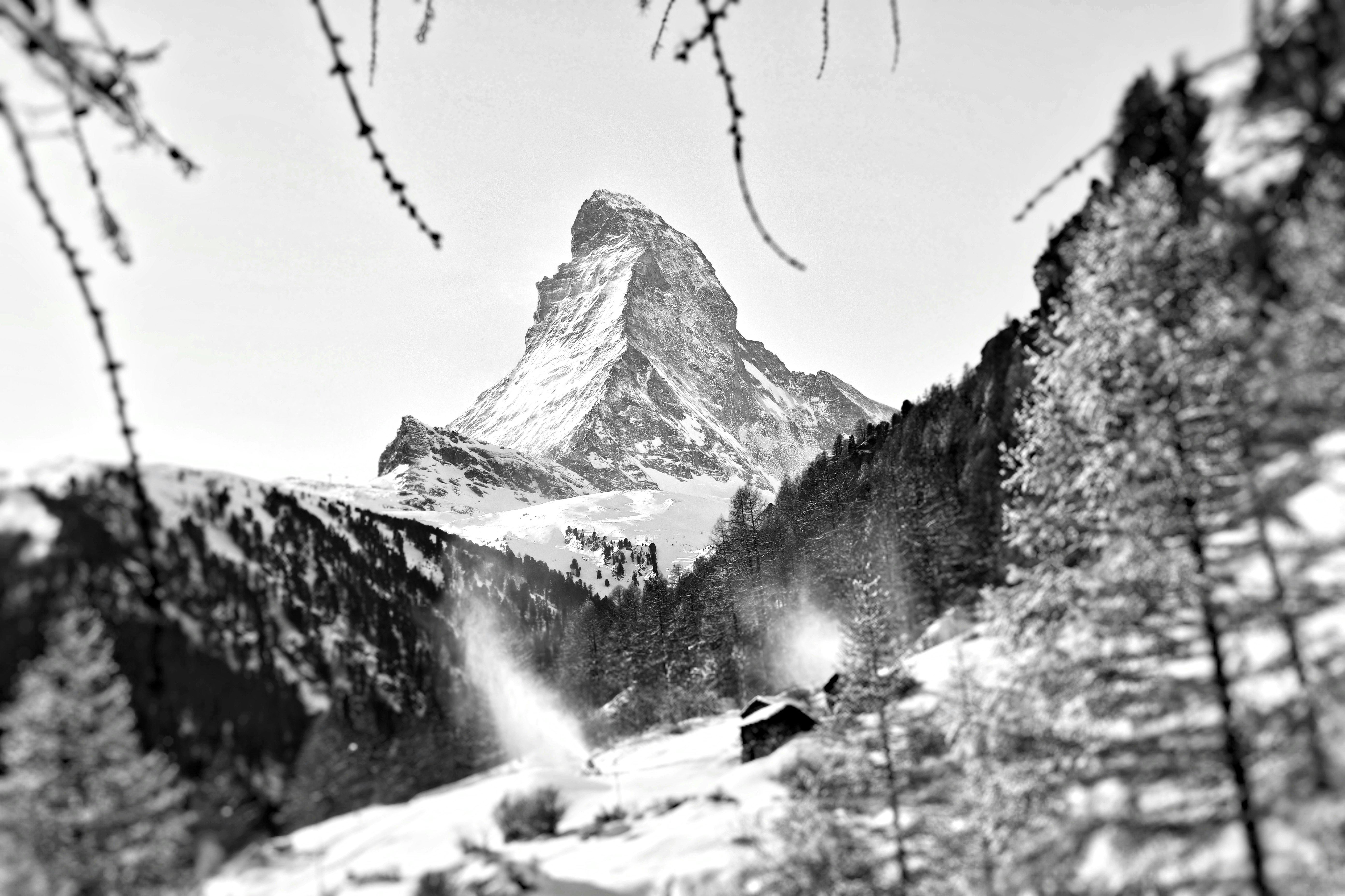 grayscale photography of field and mountain covered with snow